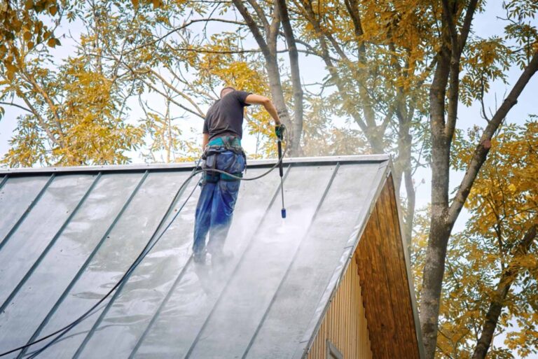 man-pressure-washer-gun-washing-roof-1