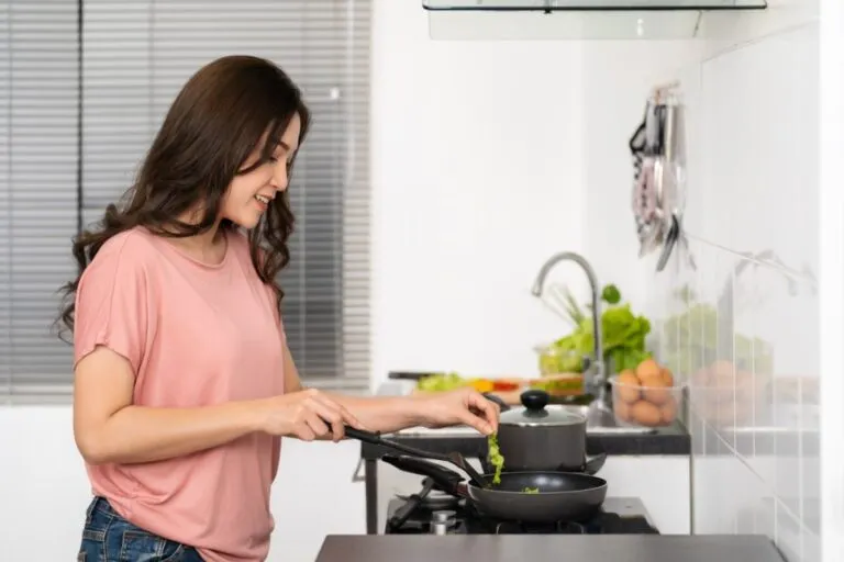 happy-young-woman-cooking-preparing-food-1